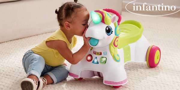 A baby girl playing with an Infantino 3-in-1 sit, walk and ride Unicorn.